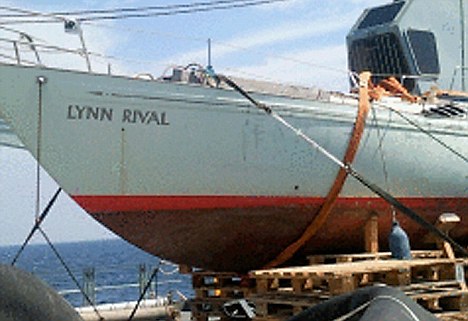 The Chandlers' yacht, lashed to the deck of the Wave Knight