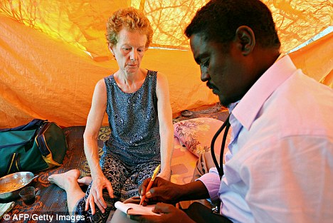 Mrs Chandler being examined by Somali doctor Abdi Mohamed Helmi at a location in central Somalia